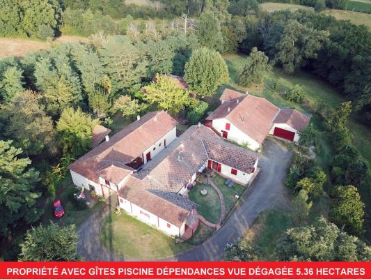 Propriété avec gîtes terrain 5.45  hectares, dépendances et